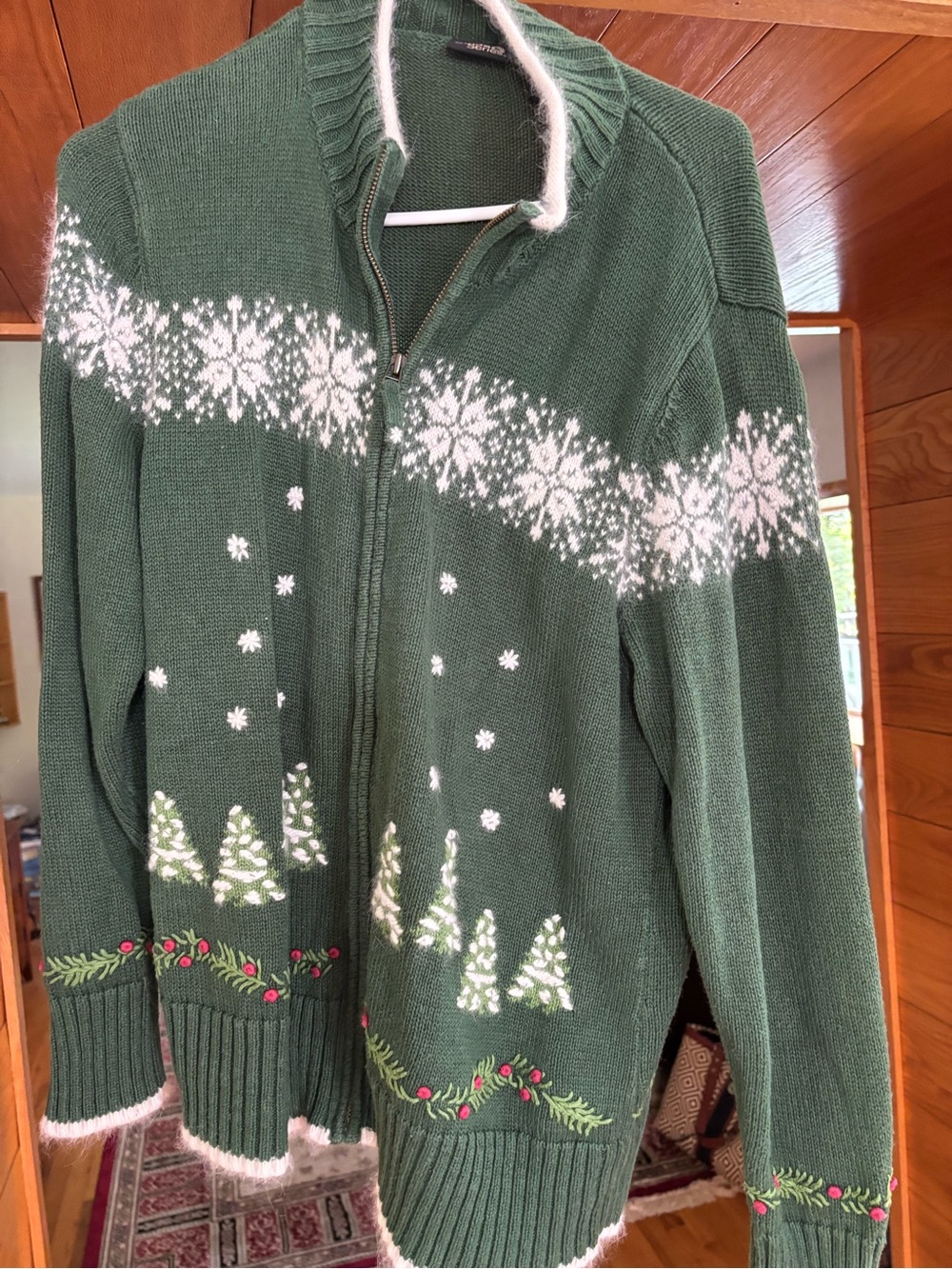 Cozy Green Zip-Up Holiday Sweater with White Snowflake Pattern